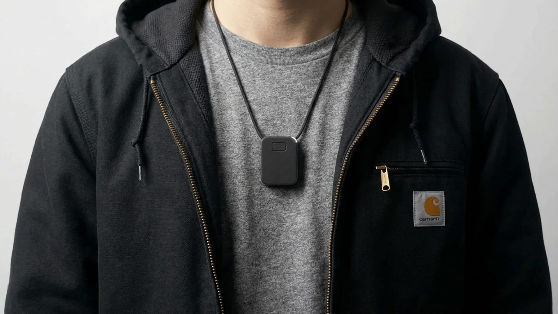 The Parlay Chip worn on a lanyard over a work jacket